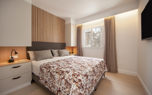 Experience comfort and elegance in this stylish, modern bedroom.