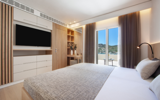 Relax in a modern bedroom with stunning mountain views.